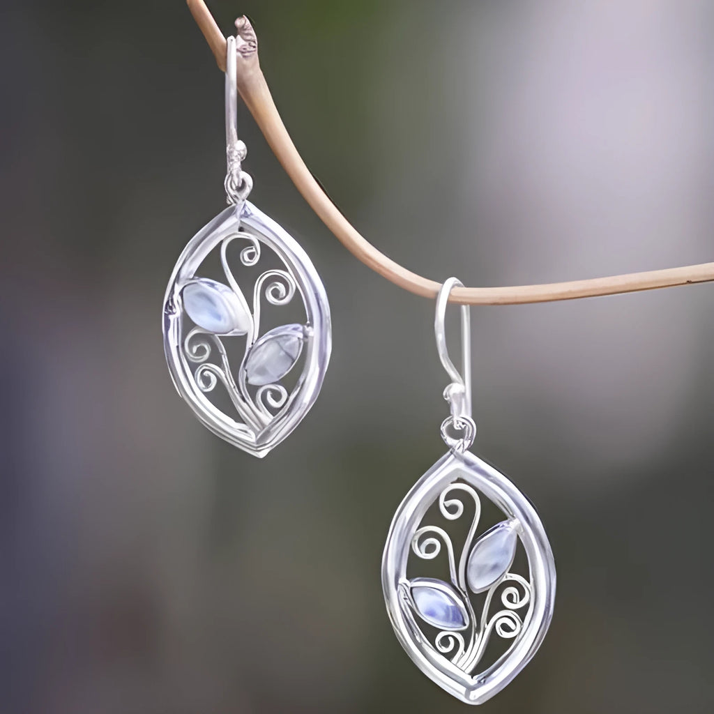 Silver colour leaf-shaped alloy earrings with embedded colourful moonstone centrepieces