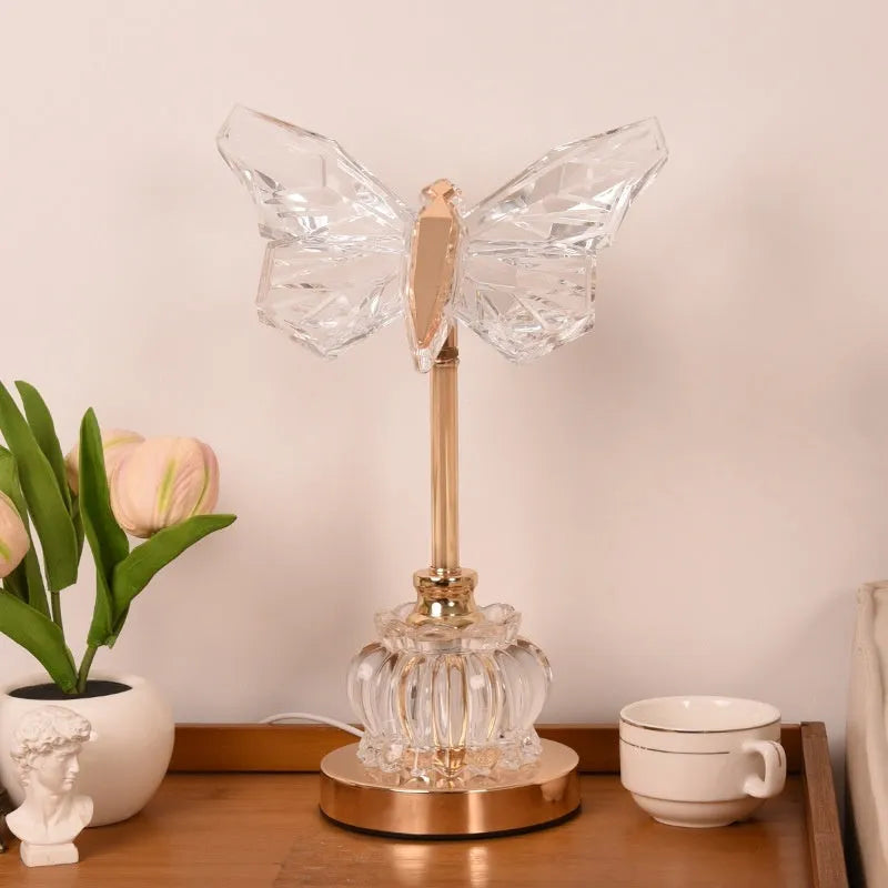 Butterfly table lamp with adjustable brightness and angle in a bedroom setting with USB plug-in