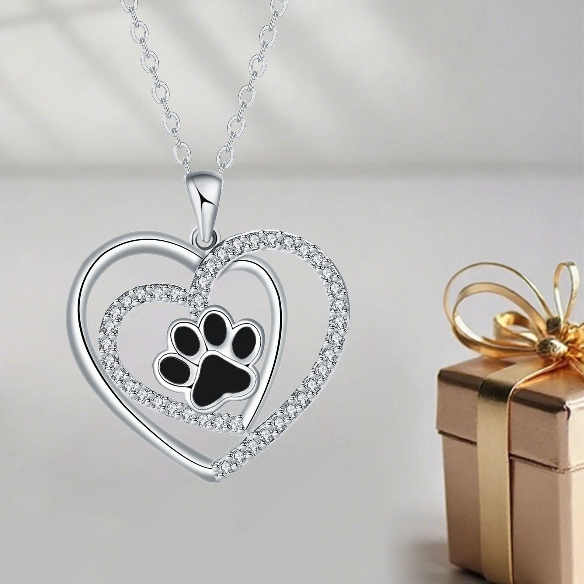 Dog's paw footprints necklace with heart pendant on cross chain