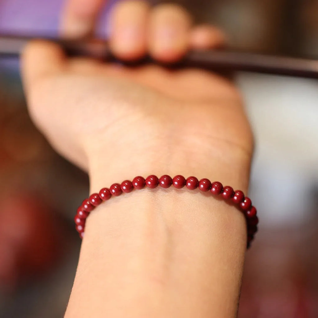 Handmade natural cinnabar bracelet with purple gold sand design and geometric Chinese auspicious patterns