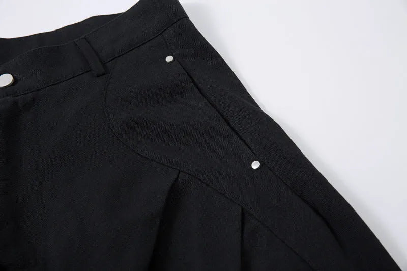 Men's black pleated casual trousers with wide-leg loose fit and machete pleat detailing
