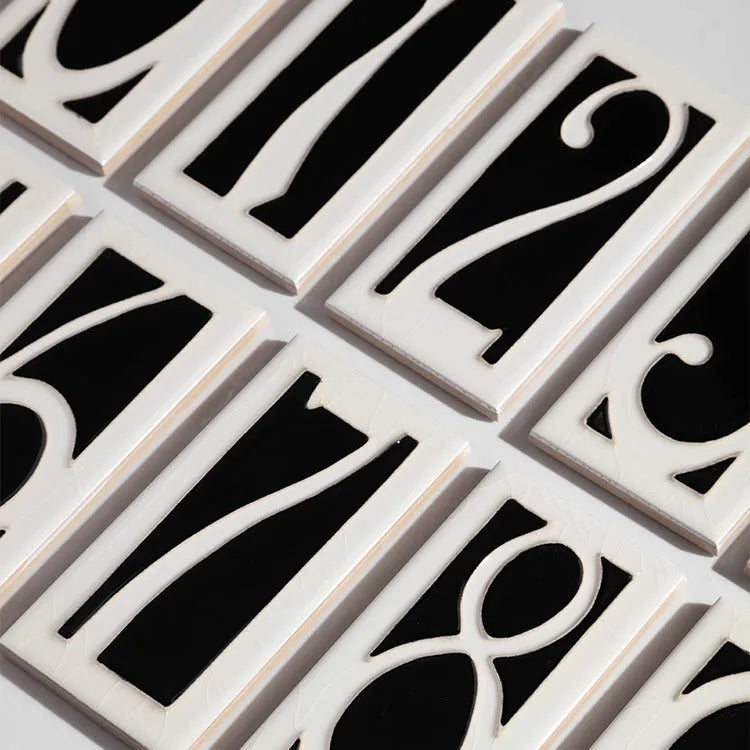 Handmade retro ceramic doorplate with glossy enamel art numbers, shown at 76mm by 152mm.