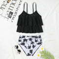Black women's high waist swimsuit with a white coconut tree floral print on the briefs.