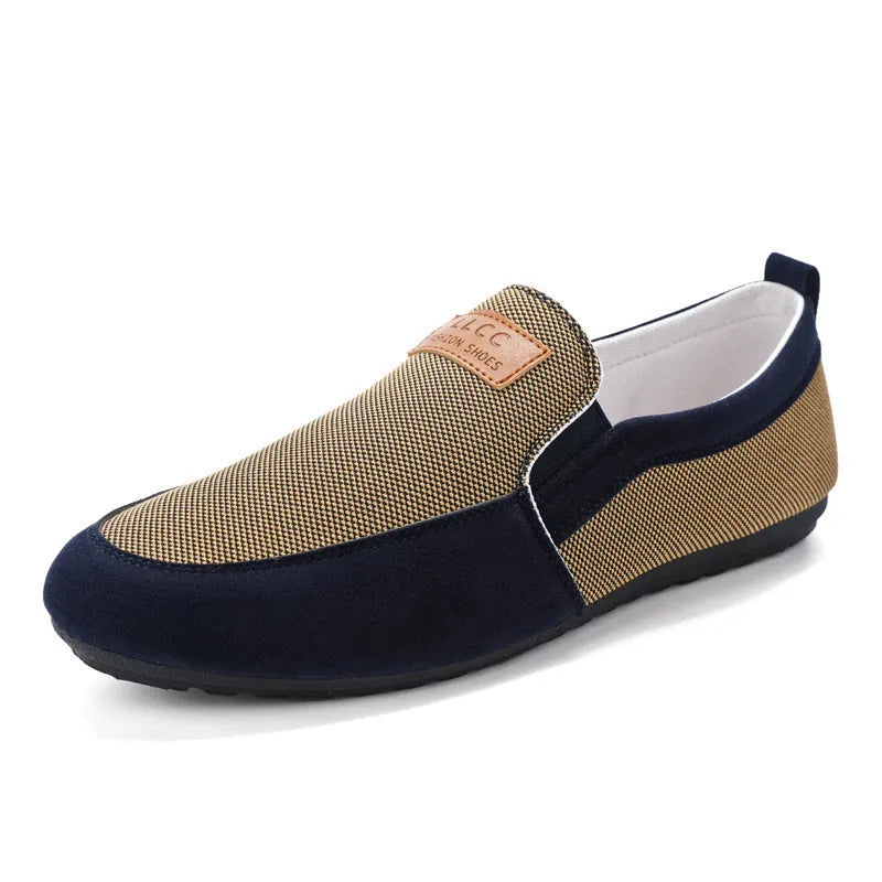Men's grey canvas lace-up board shoes with round toe and rubber sole on a white background.