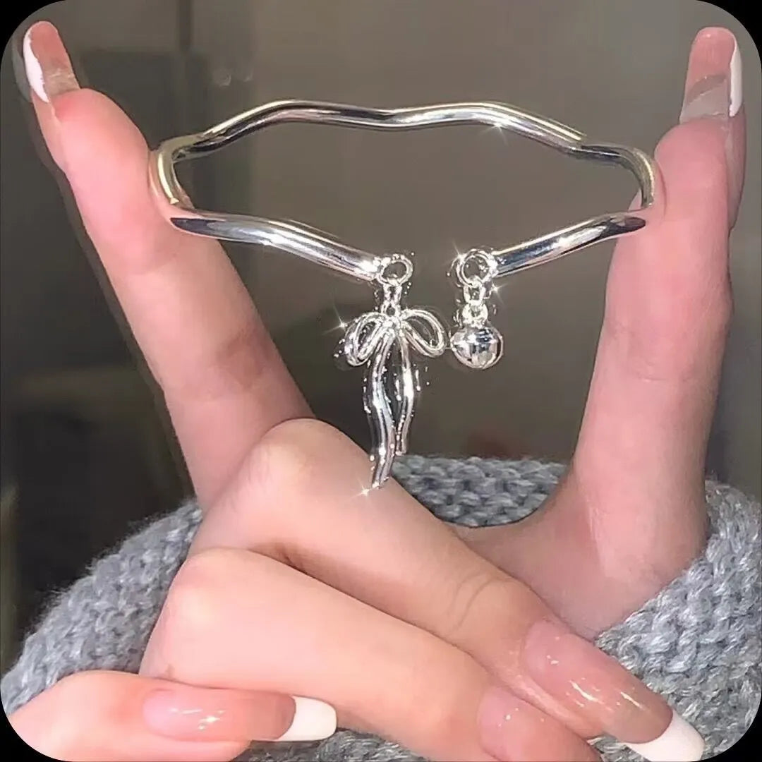 Silver adjustable bow bell opening bracelet made from zinc alloy
