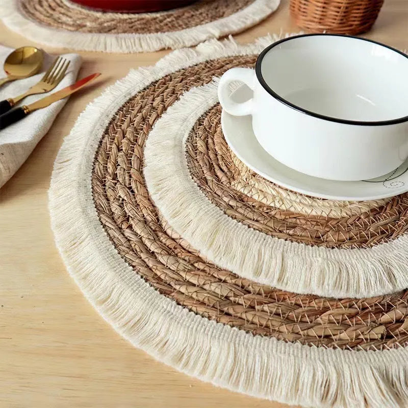 Round Japanese placemat made from natural papyrus with decorative tassels in modern simple style