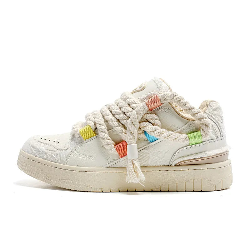 Creamy white retro skateboard shoes with lace-up front and platform rubber sole.