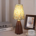 Nordic retro ceramic table lamp with pleated fabric shade and remote control on a bedside table