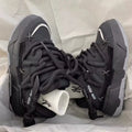 Women's grey retro chunky platform sneakers with thick rubber sole and lace-up design.
