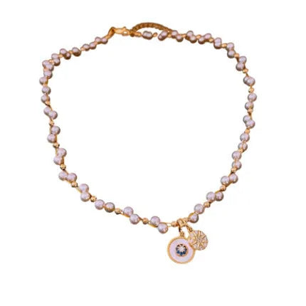 Golden-white electroplated necklace with round pearl pendant on adjustable clavicle chain