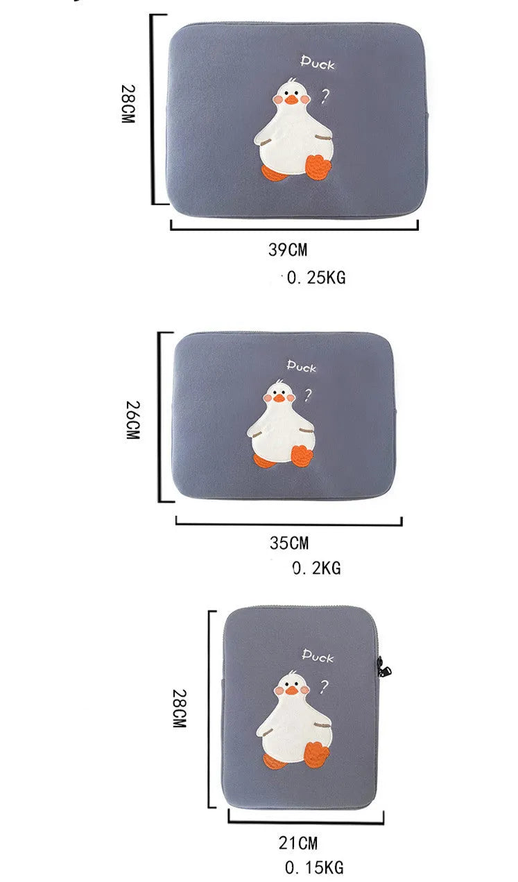 Blue cotton tablet case with embroidered cartoon duck design and a zipper, sized for an iPad.