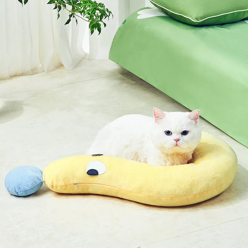 Blue pet sleeping pillow measuring 62cm by 39cm on a dog bed