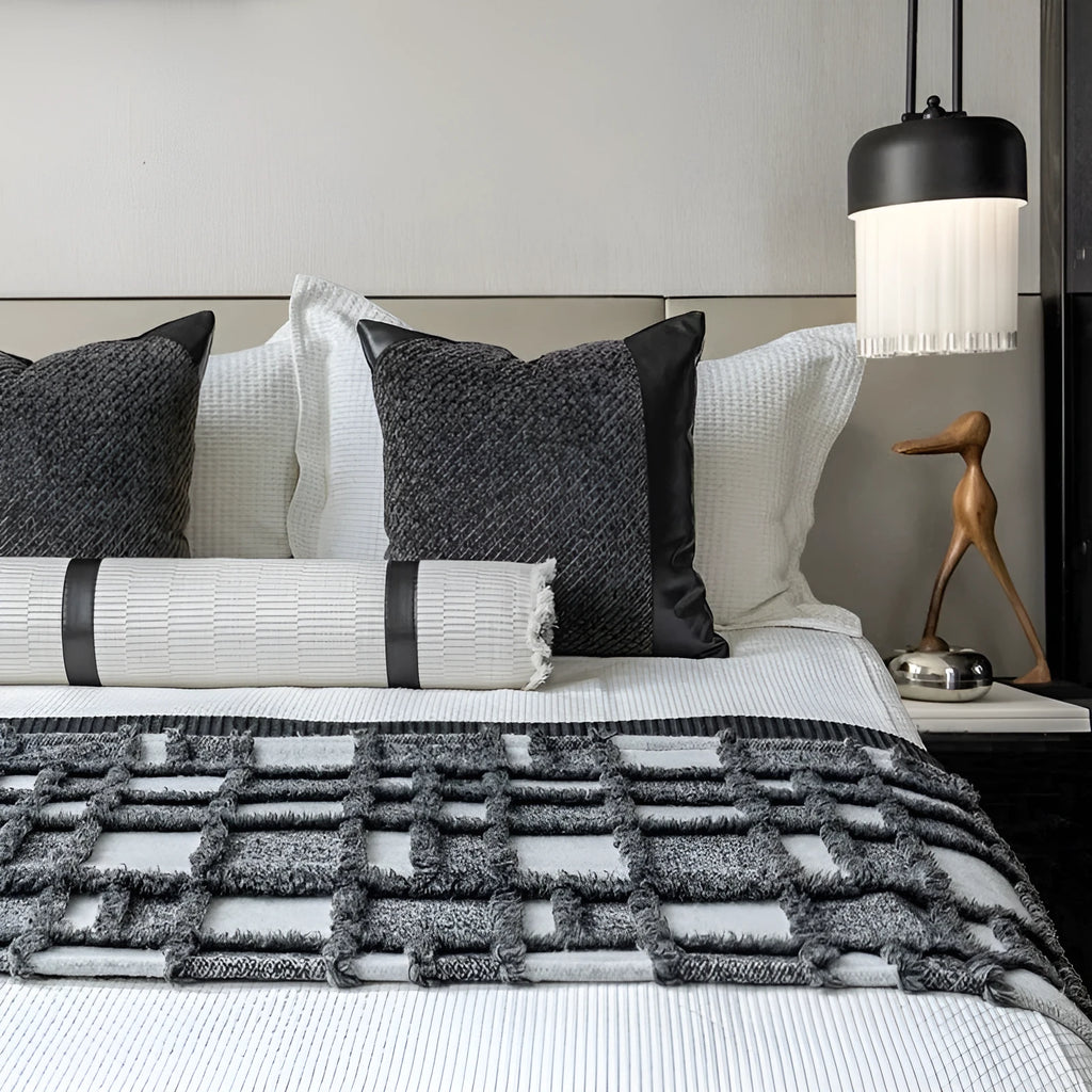Grey and white plaid polyester bed runner nap blanket set with pillow on a bed.