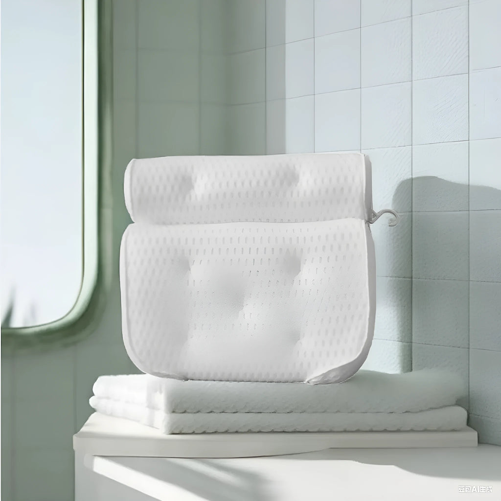 White 4D mesh bathtub pillow with suction cups on a bathtub.