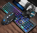 Black three-piece Steampunk Manipulator wired gaming keyboard, mouse and headset set on a desk