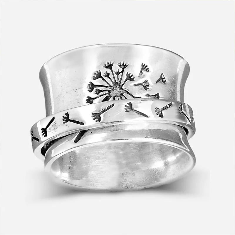 Silver rotatable flower ring showing petal detail and band, displayed with sizing options 7 through 11