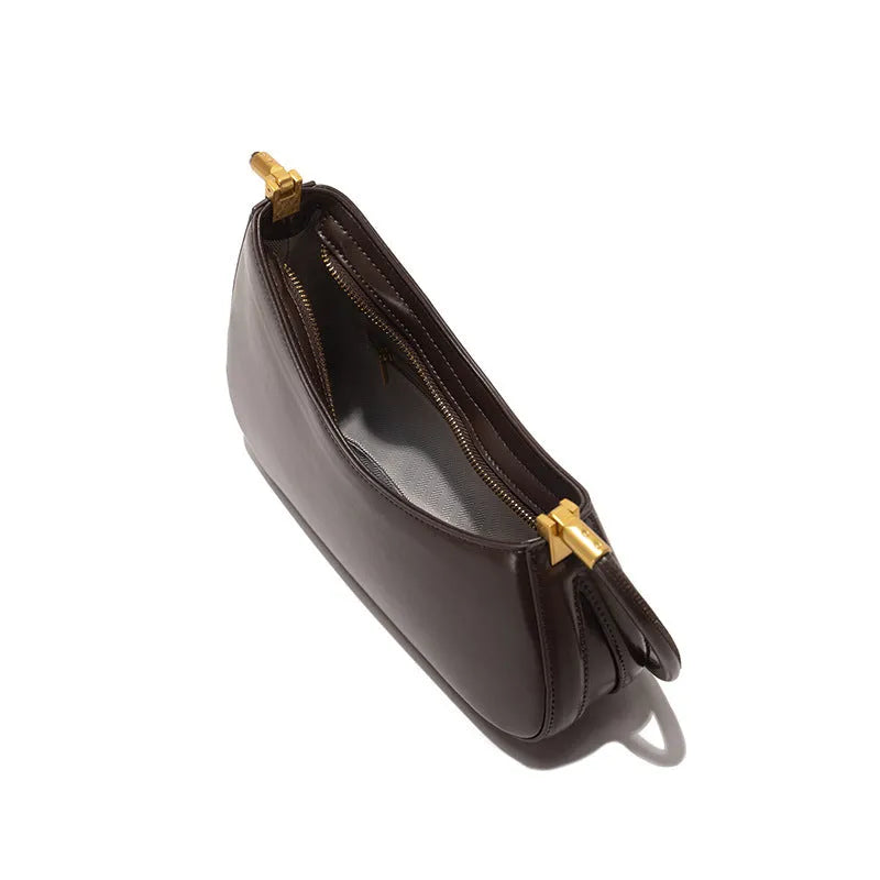 Retro oval women's underarm bag in PU leather with single shoulder strap and internal zipper compartment