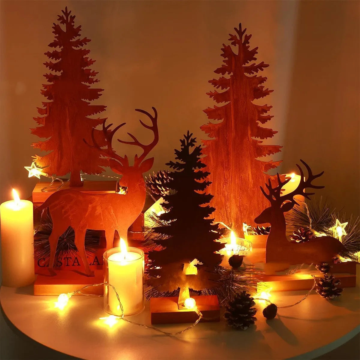 Set of three rustic metal Christmas tree ornaments with integrated elk designs, iron construction, antiqued finish.
