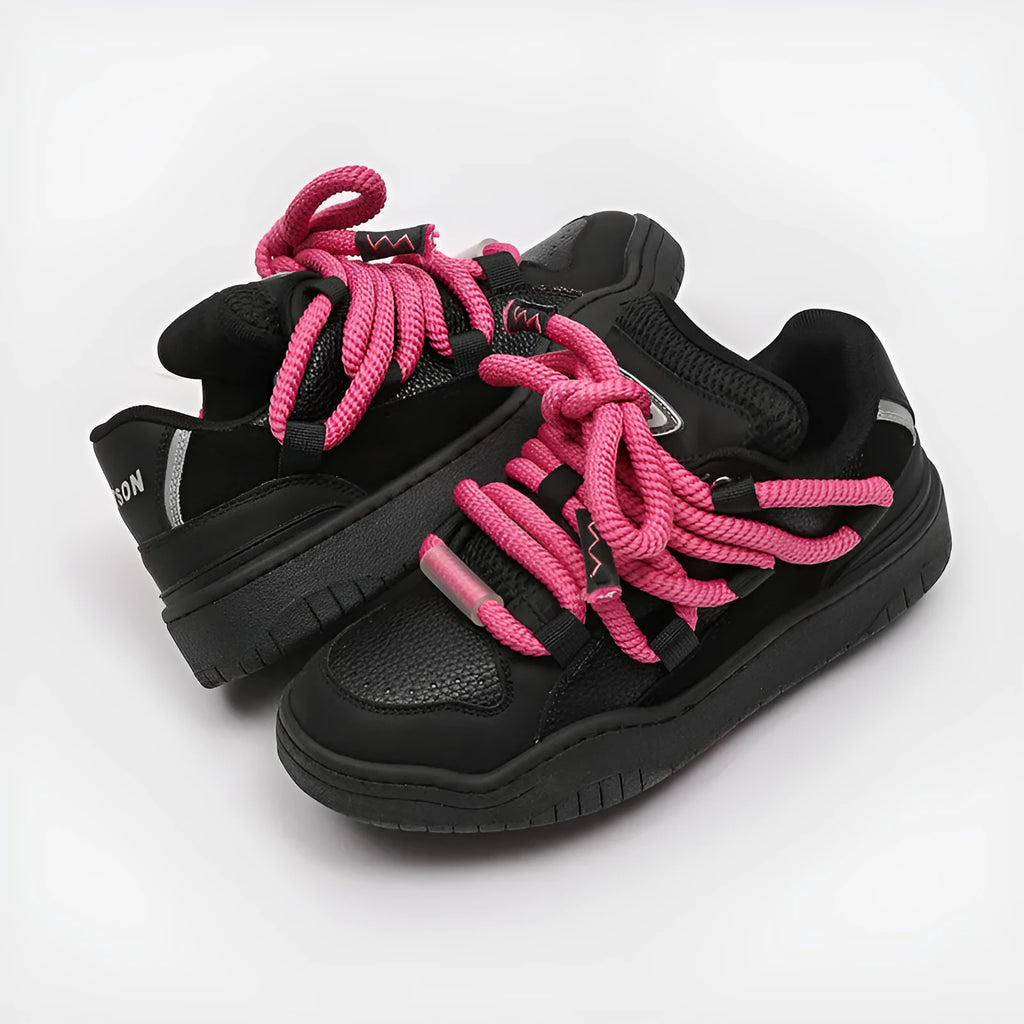 Thick bottom lace-up casual sneakers in denim blue with a round toe and flat rubber sole.