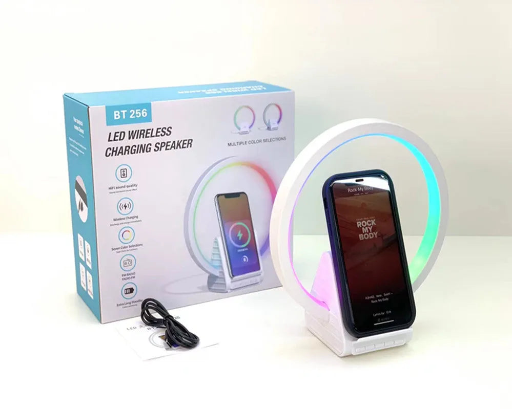 White rectangular Bluetooth speaker with wireless charging surface and ambient lighting