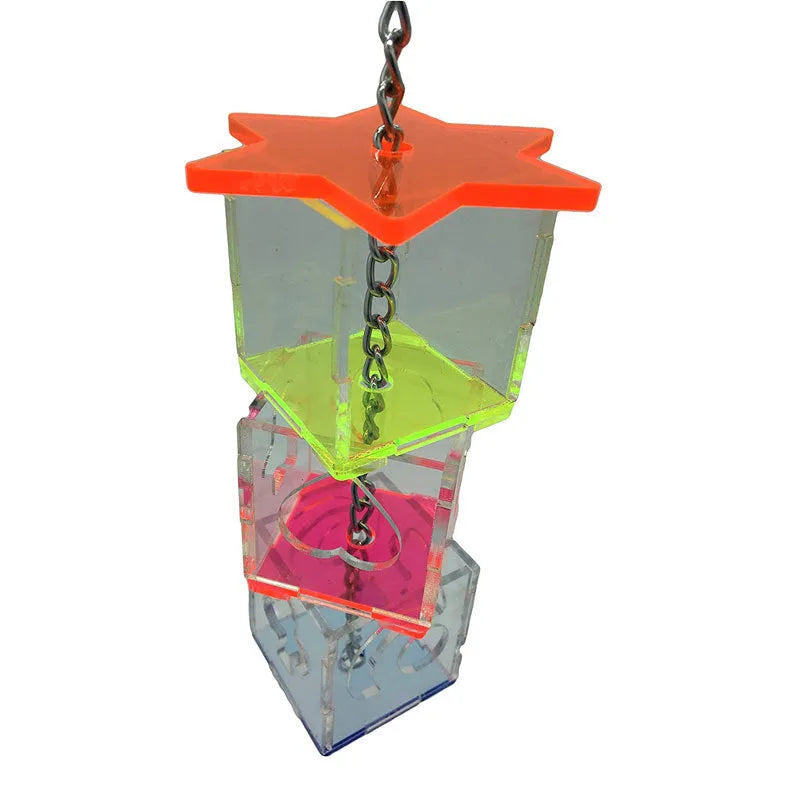 Clear acrylic parrot foraging toy measuring 32cm long, filled with bird treats.