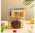 Five-in-one plastic seasoning container box in orange on a kitchen countertop