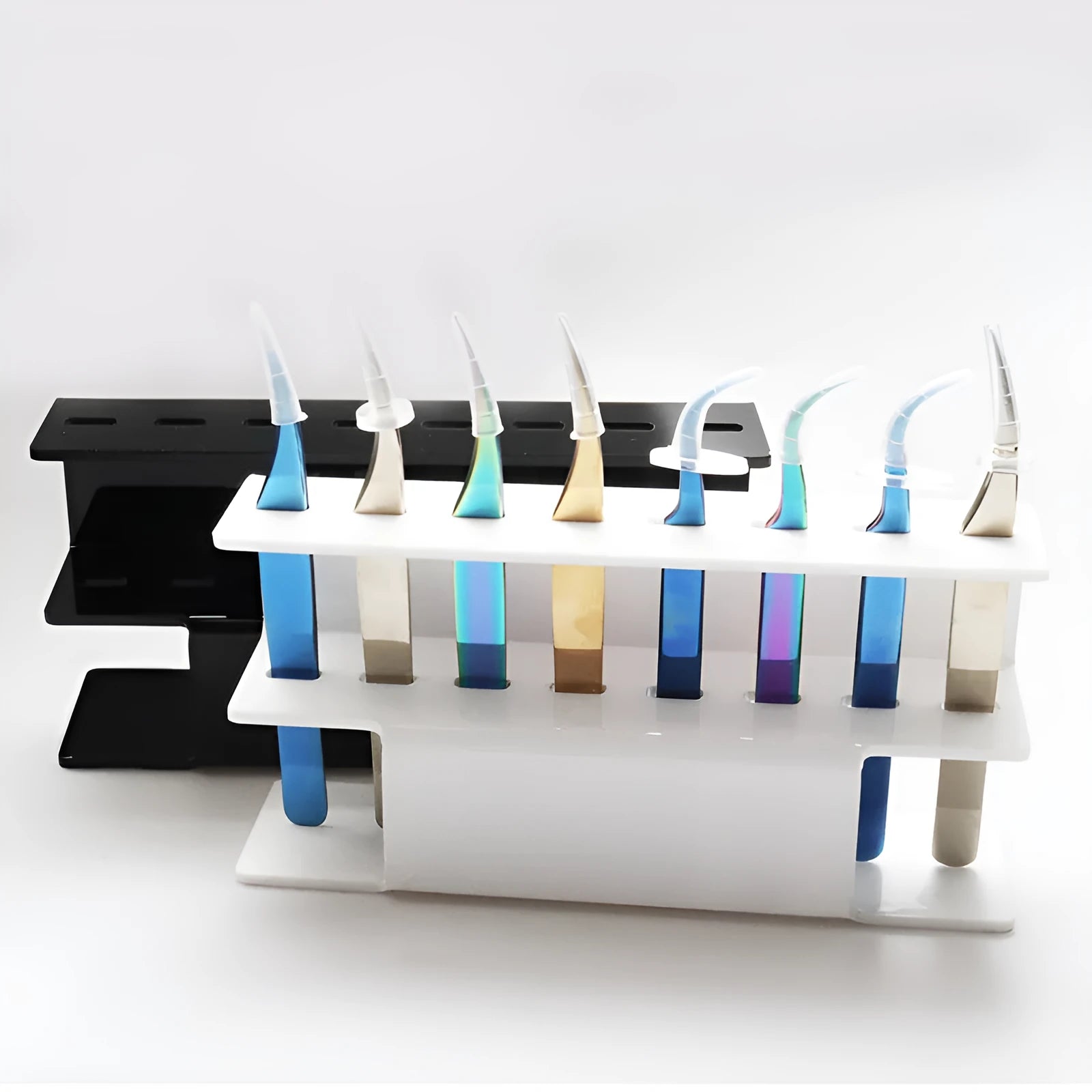 Acrylic tweezers display stand in white finish holding multiple tweezers upright