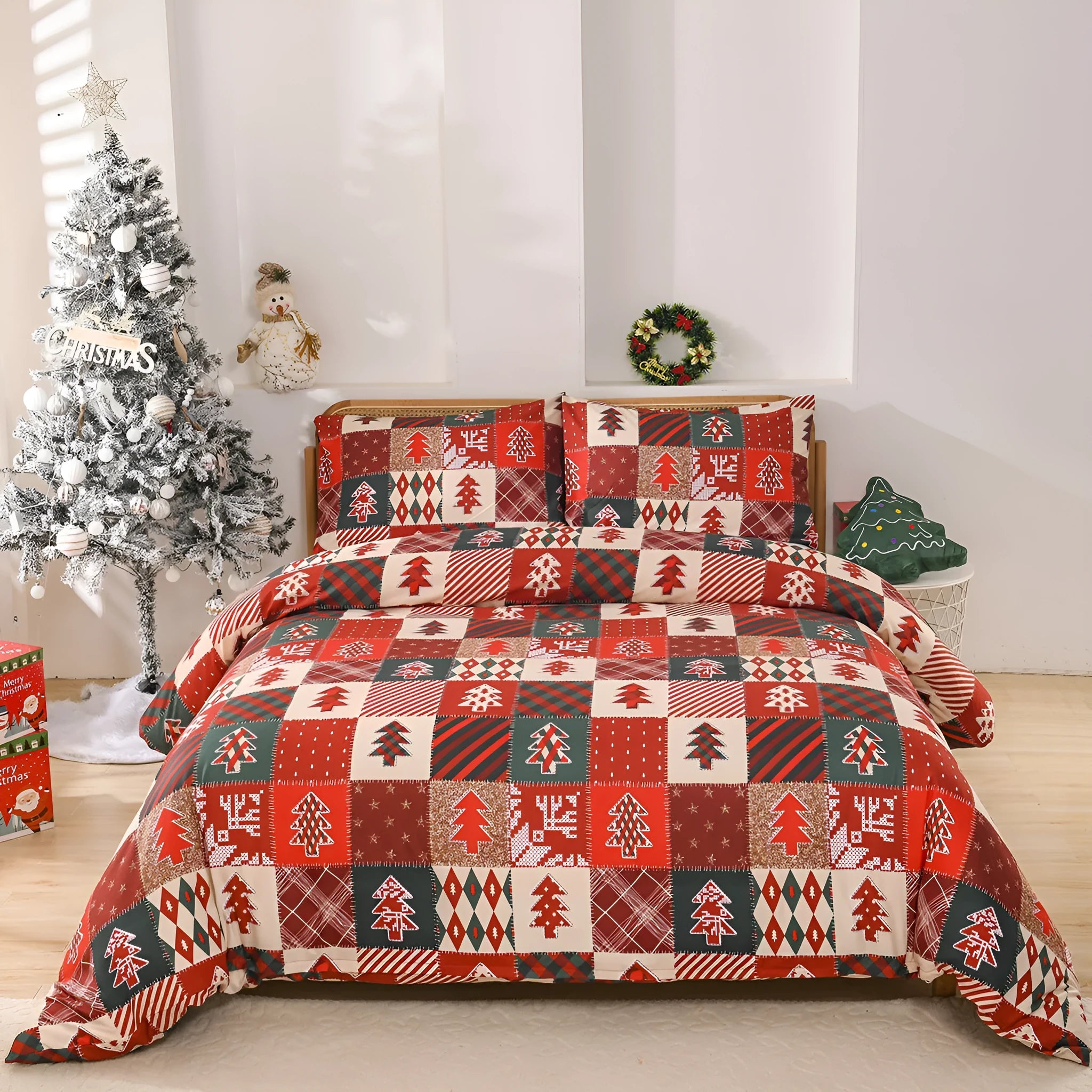Red and white plaid Christmas pattern quilt cover and pillowcases on a bed.