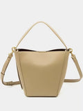 New Springsummer urban minimalist crossbody shoulder bag bucket style in black PU with front pocket