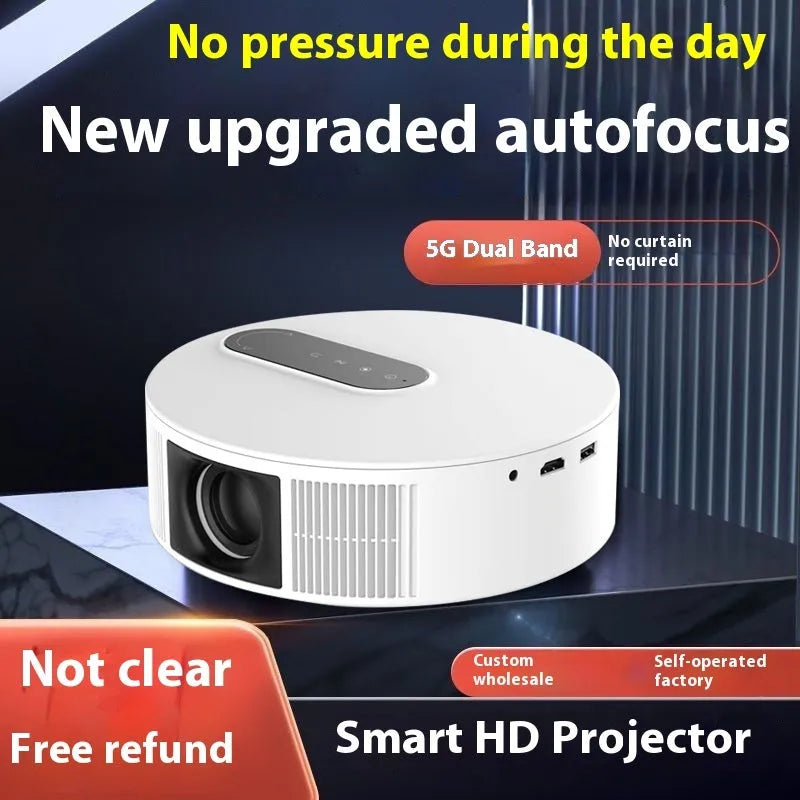 White HD home projector with remote control on a wooden table