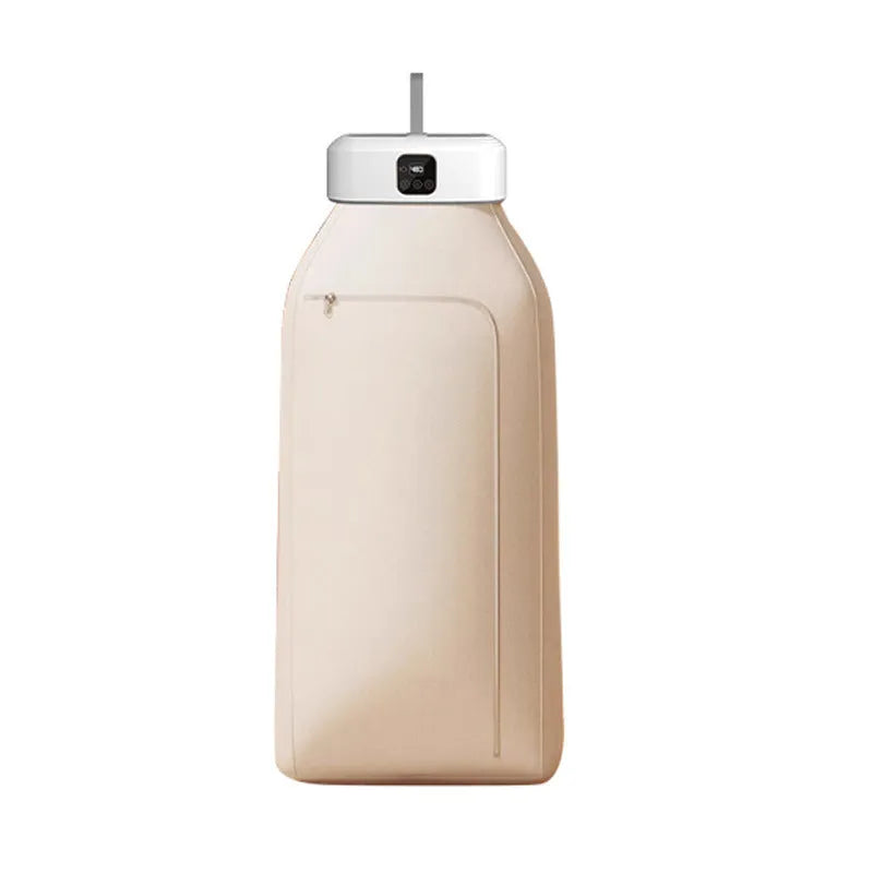 White cylindrical compact laundry drier with remote control on countertop