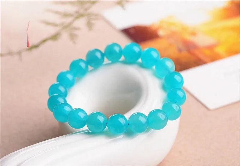 Natural amazonite scattered beads in ice colour grades for jewellery making, showing polished surfaces and size variations