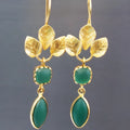 Gold retro-style drop earrings with French leaves, a tassel, and zircon stone details on a copper base.