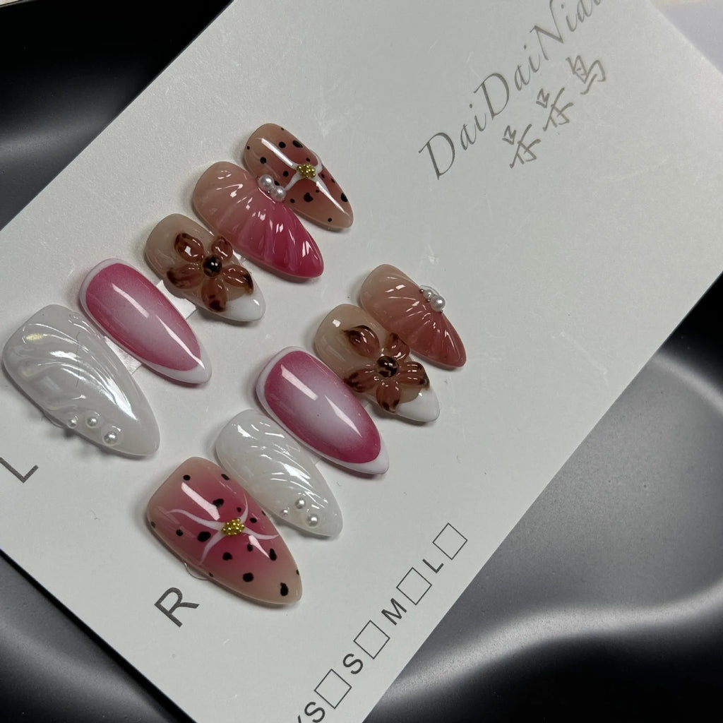 Hand-painted three-dimensional nail patches with embossed candy patterns in almond shape