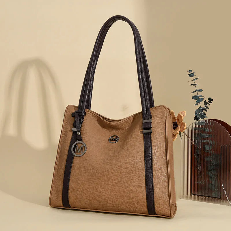 Women's large horizontal square crossbody bag in soft PU material, shown in wine red colour with double shoulder straps.