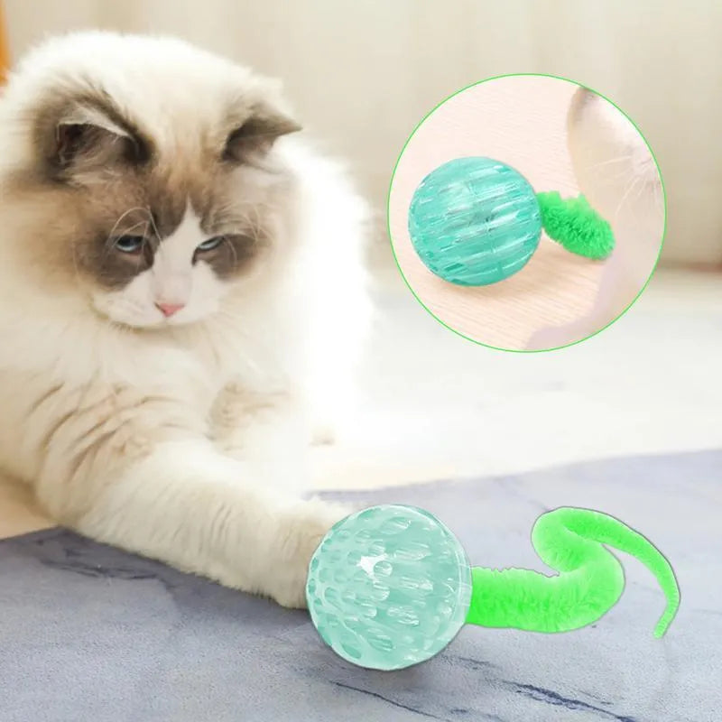 Green interactive bouncy ball cat toy with plush tail for indoor play