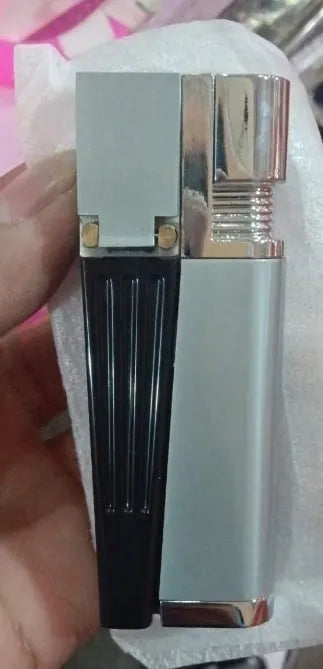 Silver foldable metal pipe lighter showing open flame and stash compartment.