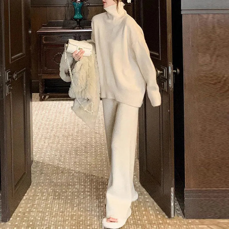 Women's milky white acrylic knit sweater and wide-leg trousers two-piece casual set.