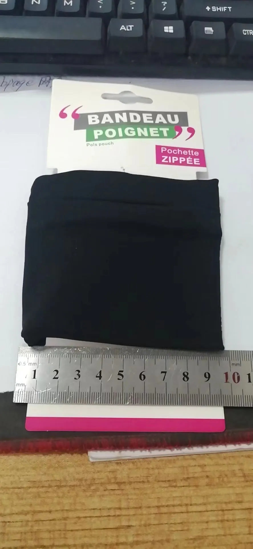 Black armband wallet with adjustable strap and 10x10.5cm phone compartment for running and hiking.