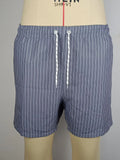 Striped polyester beach shorts in navy blue, shown with straight leg openings and triangle lining.