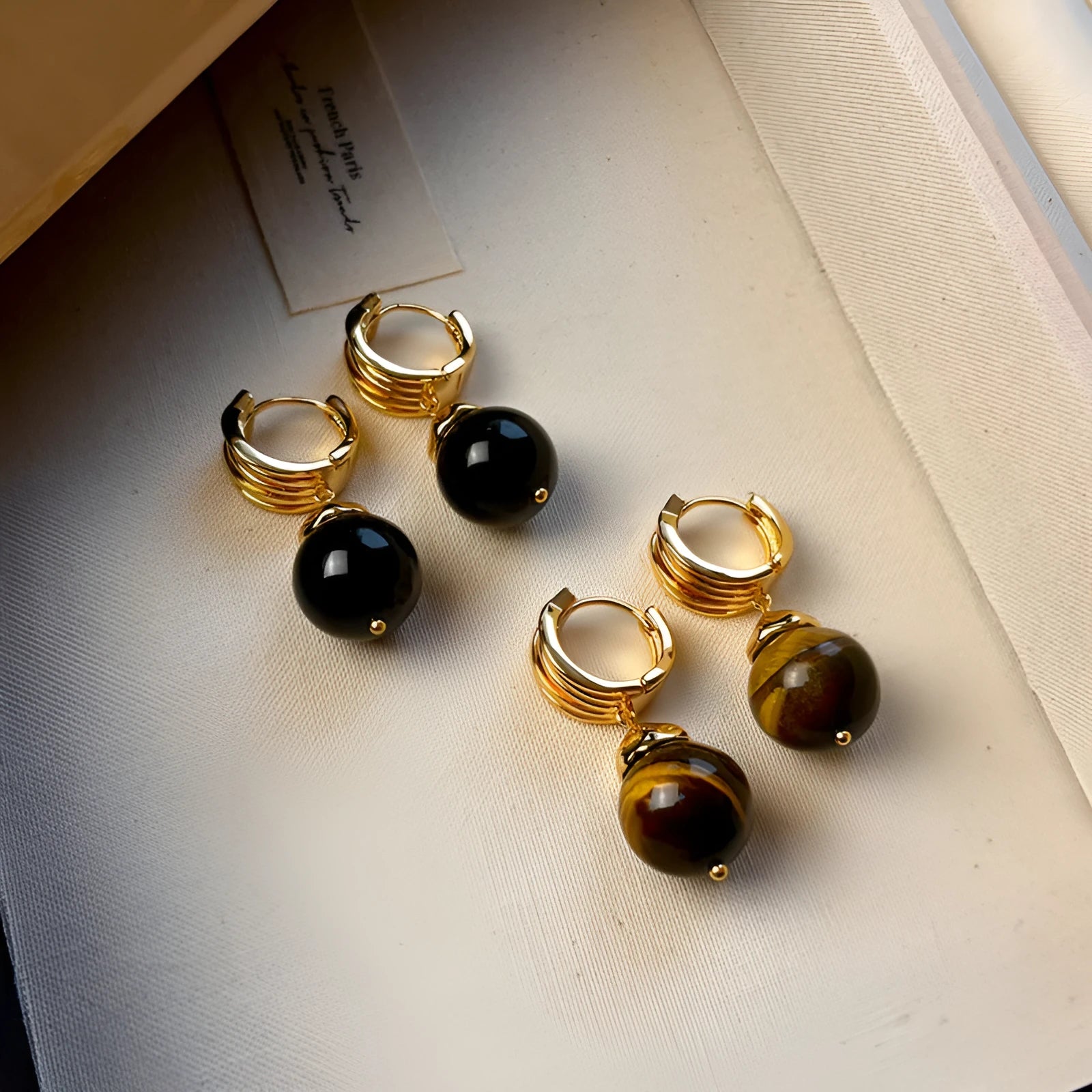 Geometric tigereye earrings for women with gold plating in black and brown colours