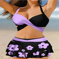 Purple and black women's bikini set with lace-up front and high-waisted split skirt.