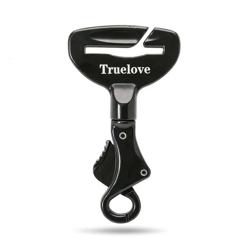 Black aluminium alloy dog car seat belt lock with 5cm tab resting on car seat