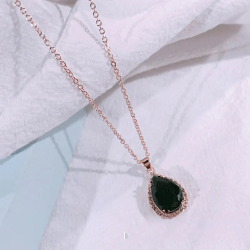 Women's geometric drop shape alloy necklace with rhinestone accents in rose gold pink colour