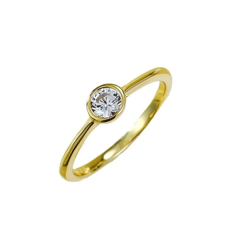 Minimalist silver crown-shaped ring with linear design, shown in electroplated gold and platinum finishes.