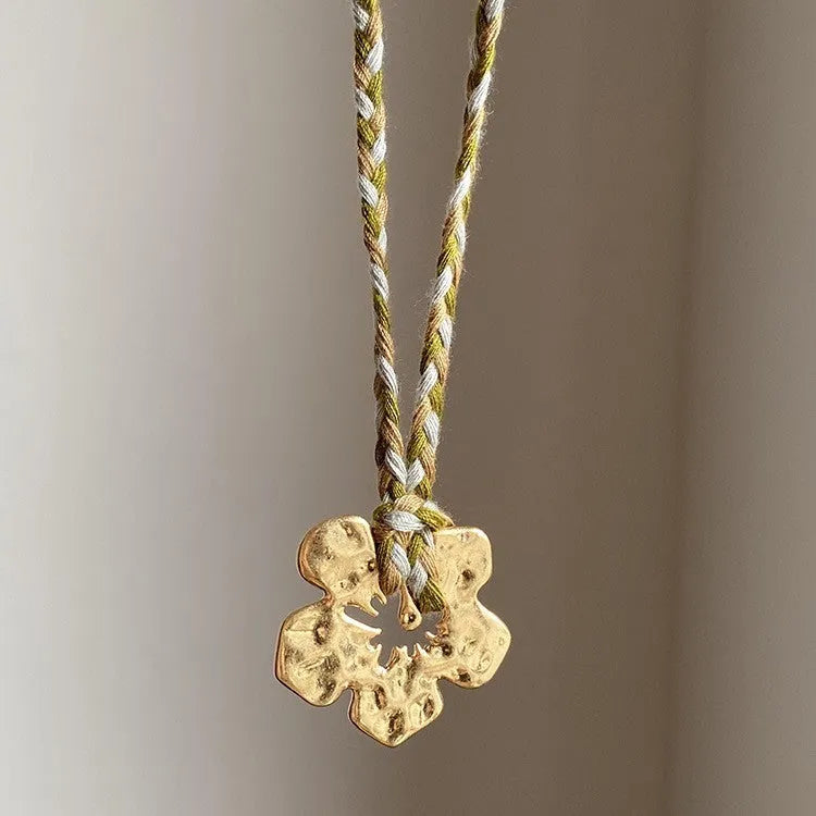 Gold hibiscus rosa-sinensis resin pendant necklace with artificial crystal bow on alloy chain for ladies