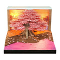 2026 desk calendar with 3D Cherry Tree paper sculpture on a desk, 8.5 x 8.5 x 6.4 cm