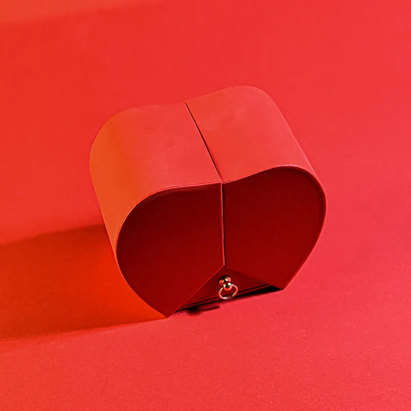 Red eternal rose necklace in apple-shaped jewellery gift box on display