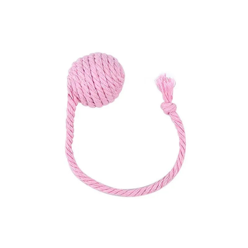 Cat toy ball with rope attached in green, pink, purple, or yellow colours with internal bell