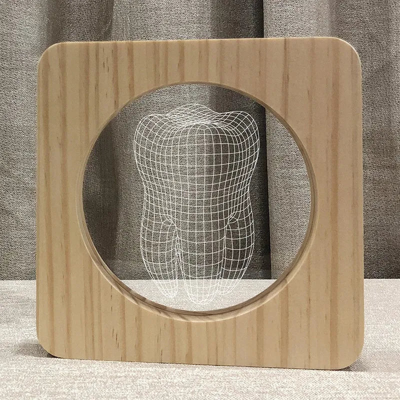 Wood-coloured acrylic night lamp in shape of a tooth, with USB cable.
